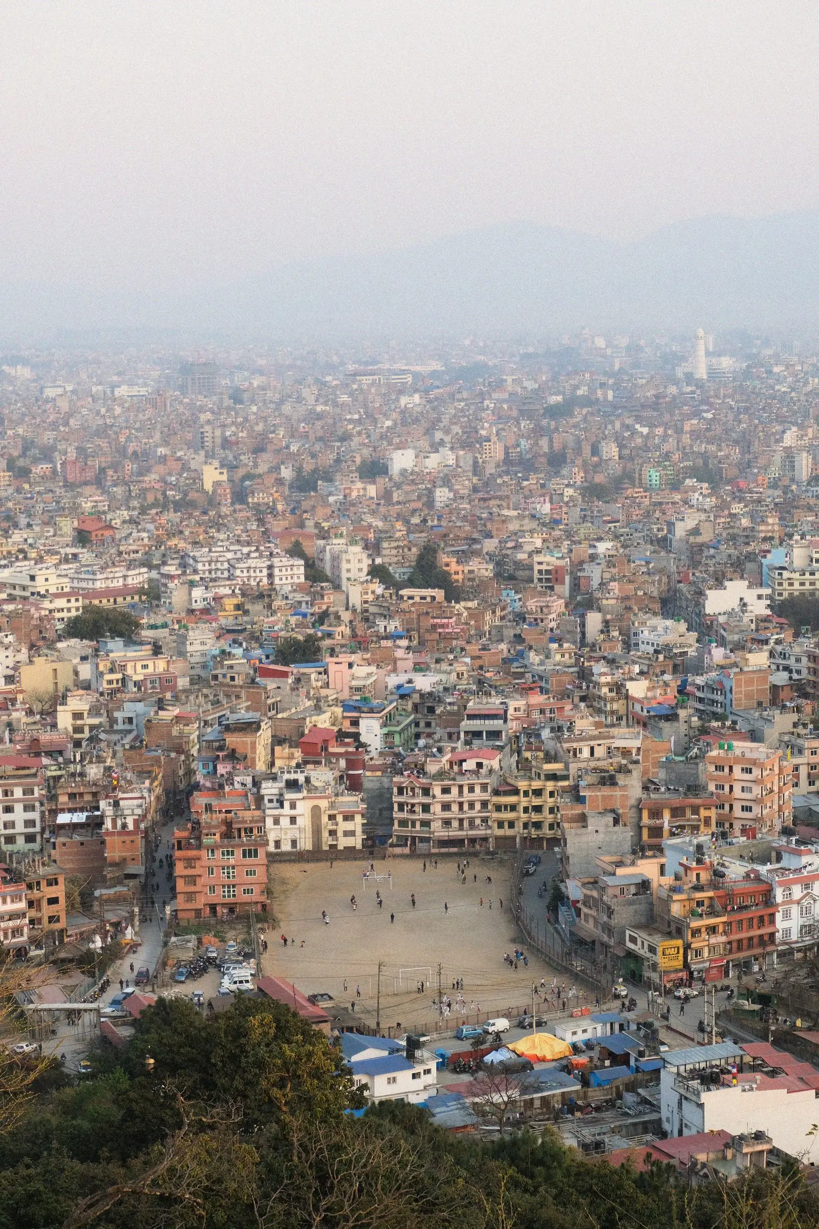 Kathmandu seen from above, dense rooftops to the horizon